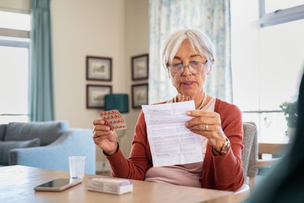 Senior woman checking medicine leaflet Helping Your Elderly Loved One Avoid Medication Mistakes