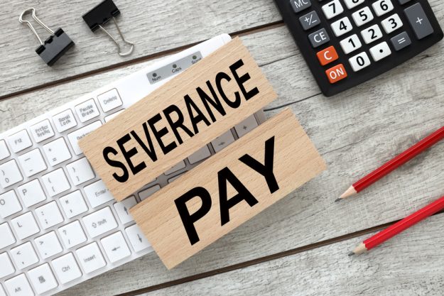 Severance Pay text on wooden blocks on white keyboard. Business concept. 5 Options To Pay For Assisted Living In Louisiana