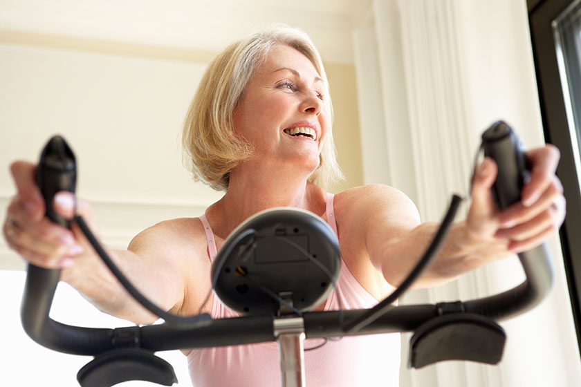 Senior Woman On Exercise Bike