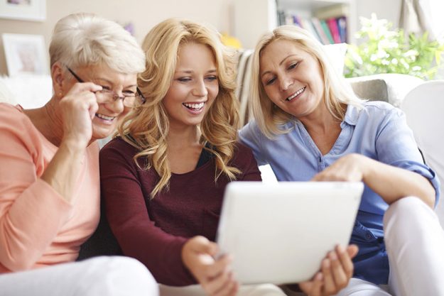 Women using digital tablet