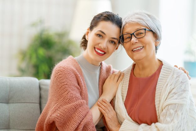 Beautiful-mother-and-daughter-are-talking-and-smiling.