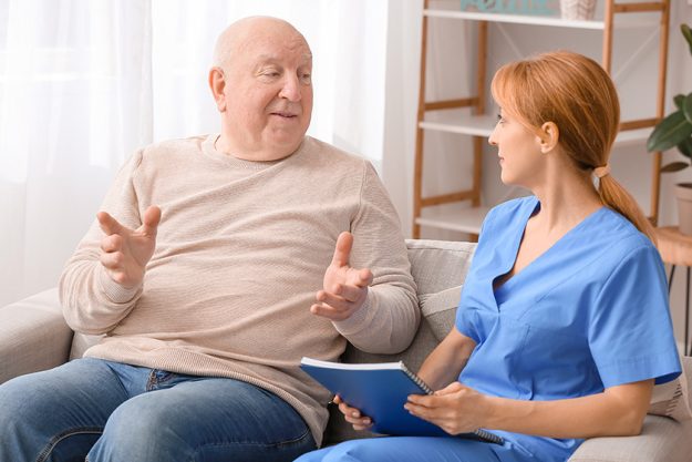 Elderly-man-suffering-from-mental-disability-and-caregiver. Elderly-man-suffering-from-mental-disability-and-caregiver.