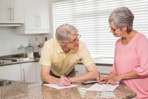 senior-couple-paying-their-bills Senior couple paying their bills