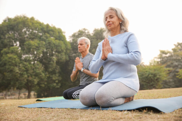 Senior-Couple-Practicing-Yoga